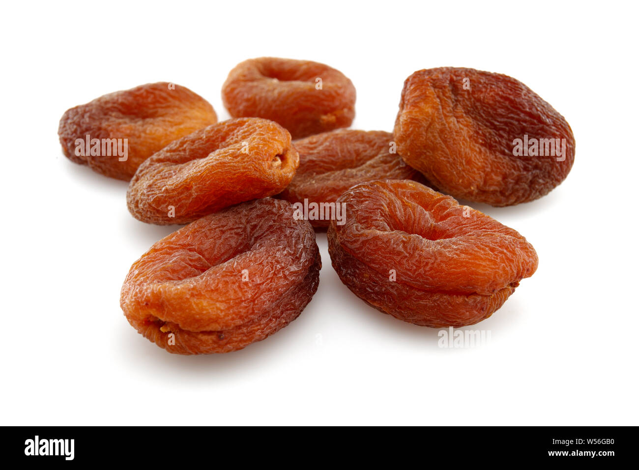 Organic dried apricots isolated on white background Stock Photo - Alamy