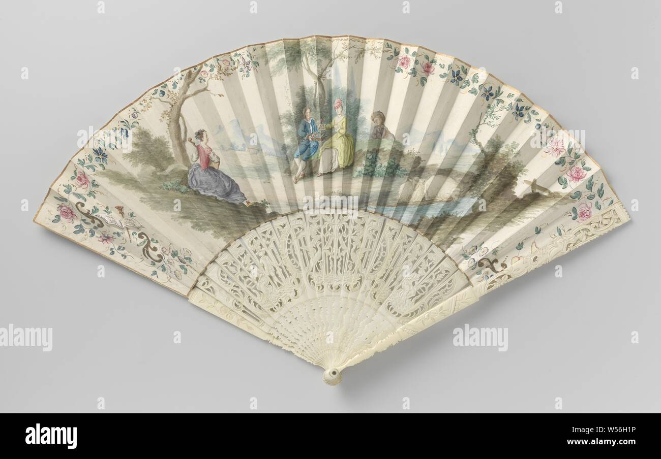 Folding fan painted with a landscape on ajour-carved frame of ivory, The parchment leaf shows a gouache-painted scene in which a man in a blue suit offers a basket of flowers to a lady in a green-yellow frock. On the left is a lady playing a musical instrument., anonymous, Netherlands (possibly), c. 1750 - c. 1775, blad, montuur, painting, s 51 cm × h 28.5 cm Stock Photo
