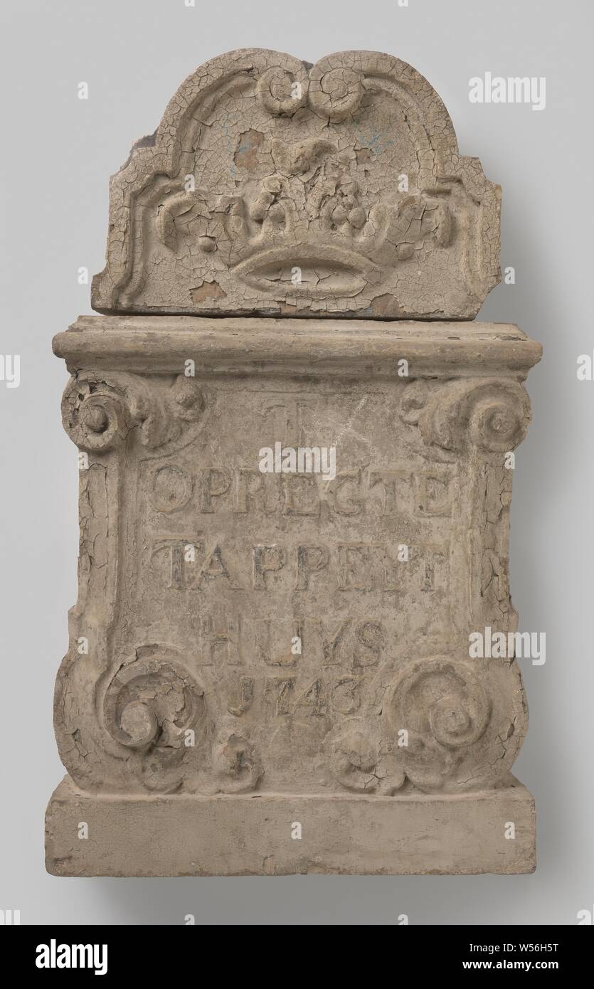 Facing brick with image and inscription: T OPREGTE TAPPEYT HUYS 1743, Standing rectangle with sides of volutes and acanthus leaves, on which the inscription T OPREGTE TAPPEYT HUYS 1743 belongs to a stone in the shape of a cartouche of volutes, within which a crown. Paint residues., Netherlands (possibly), 1743, h 43.5 cm × w 59.5 cm × d 14.0 cm h 33.0 cm × w 50.5 cm × d 10.5 cm w 113 kg Stock Photo