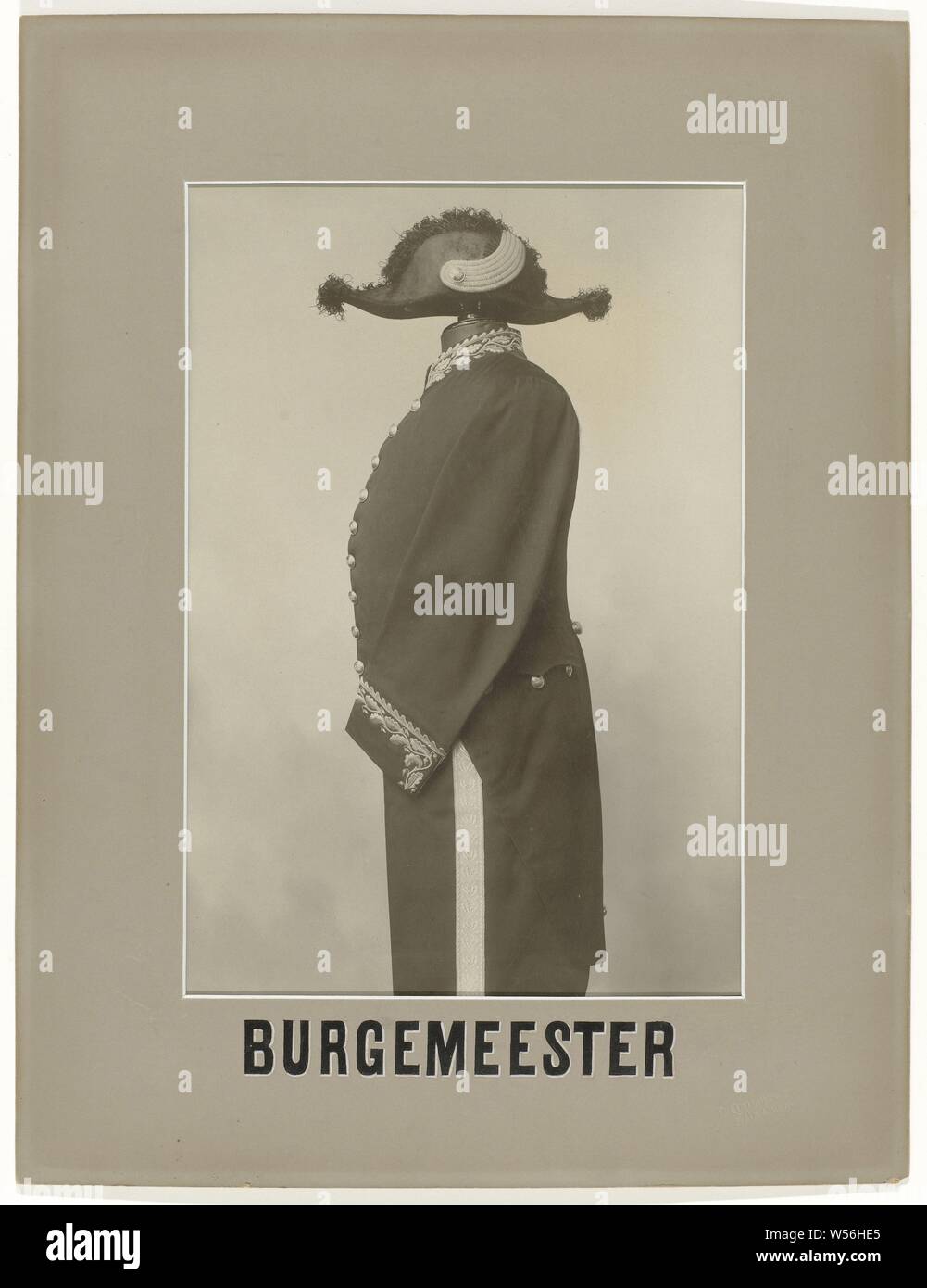 Mayor, One of eight photographs of official costumes, in gray-brown passe-partout with paint names, capitals, black letter with white 'shadow'. Caption: MAYOR. Marked, r.o .: relief stamp: 'P. Clausing jr / Haarlem ', P. Clausing, Haarlem, 1875 - 1900, paper, cardboard, h 55 cm × w 42 cm Stock Photo