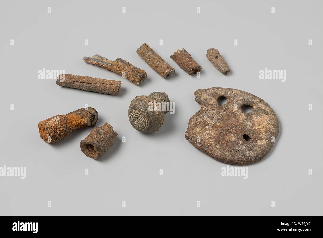 Parts of syringe syringes from the wreck of the East India dealer Hollandia, Tools and instruments, medical, enema syringe, fragm, corroded: finial, spherical with engraved concentric circles on top, hollow shaft underneath, broken off: fragm or lower end of shaft, hollow, with remains of piston: fragm of needle, fragm of needle, straight tapering tube, flanged end with linear concentric engravings, internally threaded: fragm of needle, fragm or perforated disc, broken, 4 circular holes, Annet, Dutch East India Company, Hollandia (ship), anonymous, Netherlands, 1700 - in or before 13-Aug-1743 Stock Photo