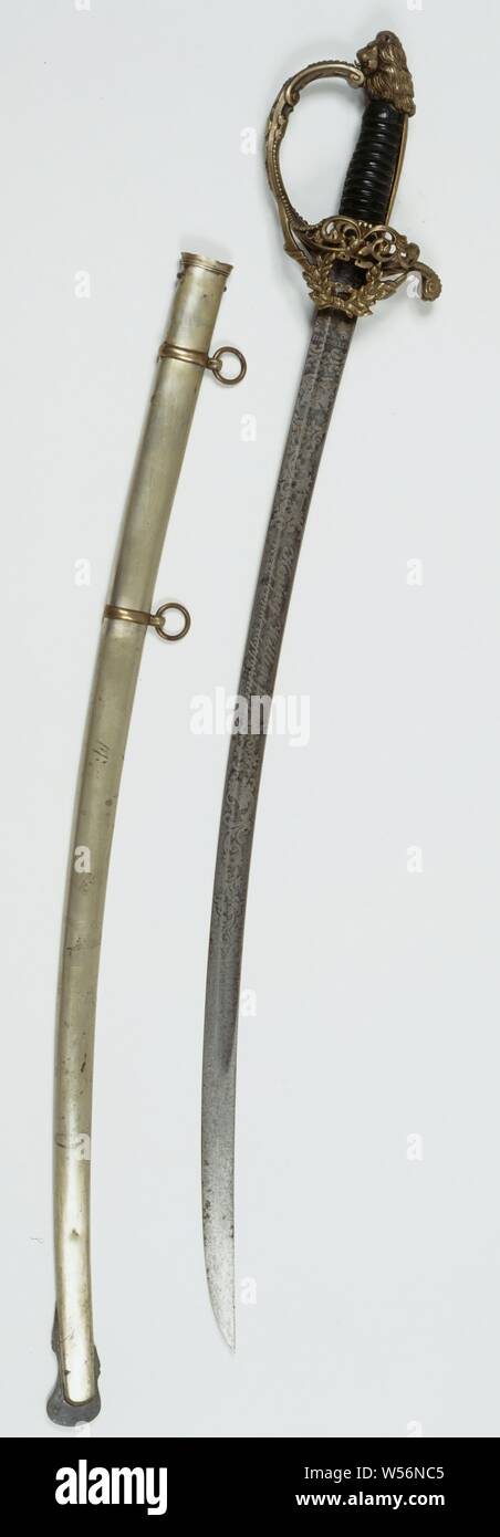 Honorable with sheath awarded to captain of the infantry H.E. Schoggers at Simpang Olim on November 14, 1876 for showing bravery, Saber in sheath. Fire-gilt copper hilt, lion-shaped knob, openwork side bar with laurel wreath and missing ornament: see holes. Wooden ribbed handle wrapped with braided copper wire. Iron curved blade, one-sided with trenches, both sides etched with remnants of fire gilt and probably blued. Signed on one side: Yzerhouwer, above it the Rijkswapen. 'King Willem III ' 'for bravery Stock Photo