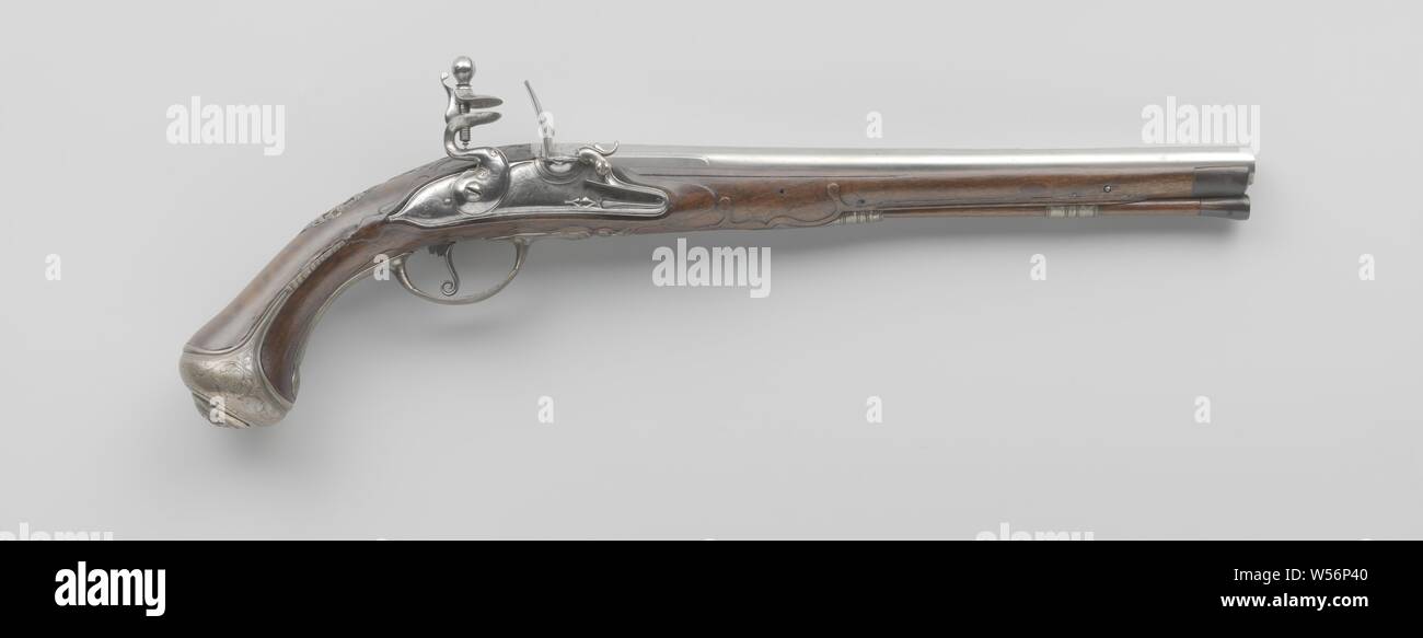 Flint gun, The lock is simply engraved with leaf scrolls, fantasy animals and a signature. A ridge runs down the barrel almost to the trumpet, the ridge and the back of the barrel are engraved and the ridge is stamped with the mark of Utrecht and at the bottom with a mark that looks like an arrow, engraved with the same signature as the lock, the breech of the loop is basculating. The front drawer of the flask is provided with a cow horn cap, the flask is carved with symmetrical foliage. The silver fittings consist of two loading rod sleeves of unequal length, a screw plate consisting Stock Photo