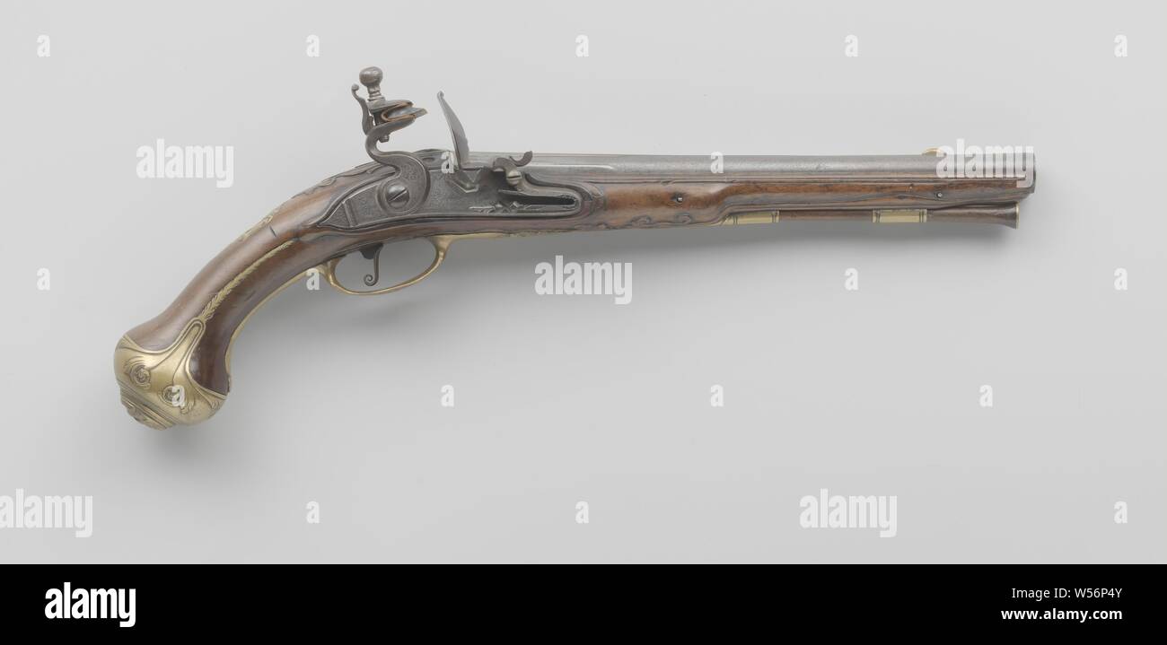 Flint gun, The lock plate has a stepped tail and is engraved with foliage in panels and a signature, the rooster is decorated in bas-relief. The barrel is stamped on the top and bottom with the coat of arms of Utrecht and has a ridge on top to the trumpet, on the tail of the barrel there is a wing-shaped rear visor, the visor grain is made of brass. The flask is cut with, among other things, acanthus leaves. The previously gilded yellow brass fittings with partially embossed embellishment, apart from the two octagonal loading rod tubes, consist of a symmetrical screw plate of ajour-worked Stock Photo