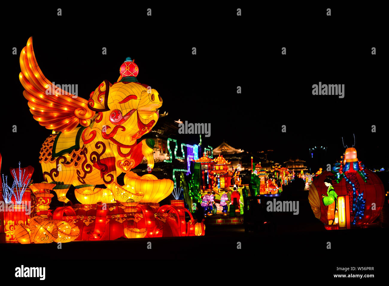 Tourists visit a lantern festival to greet the upcoming Chinese Lunar ...
