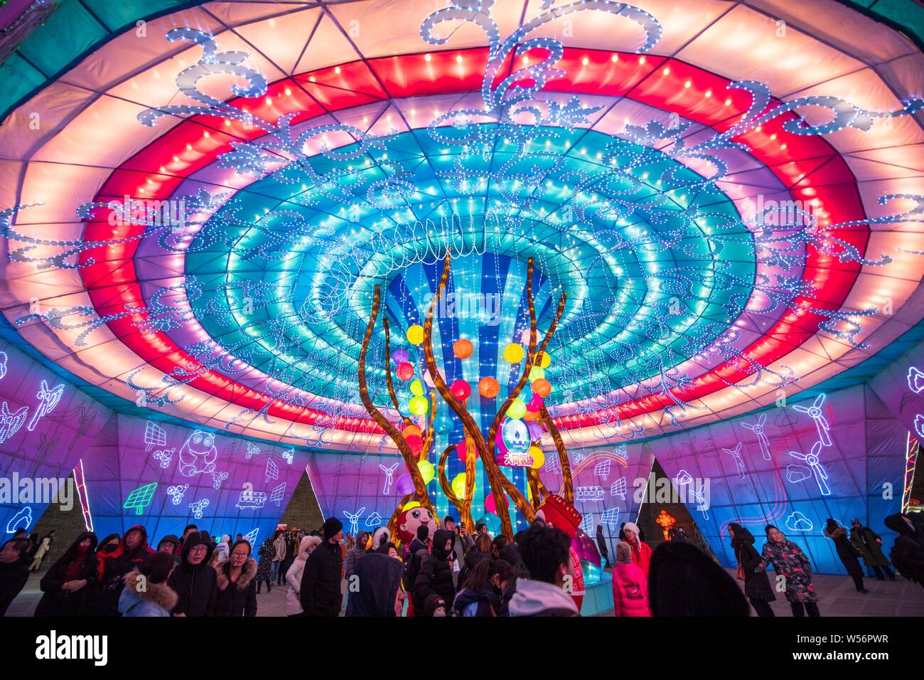 Tourists visit a lantern festival to greet the upcoming Chinese Lunar ...