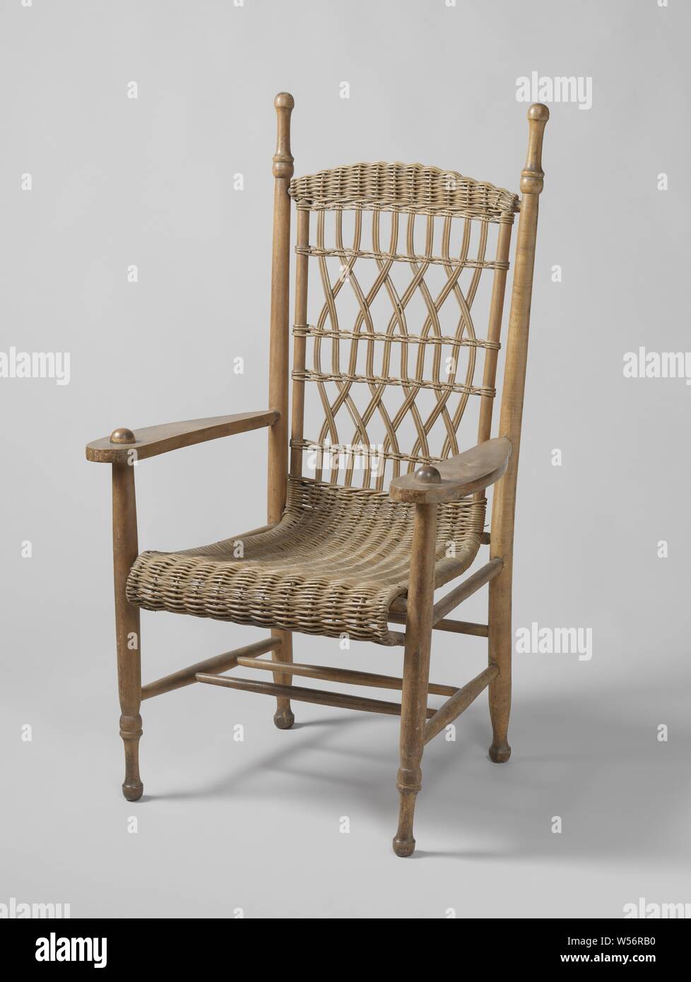 Armchair used by President Paul Kruger, Armchair, covered with toes. The  flat armrests rest on the front legs, which, like the back posts and rungs,  are turned. High back. This chair was