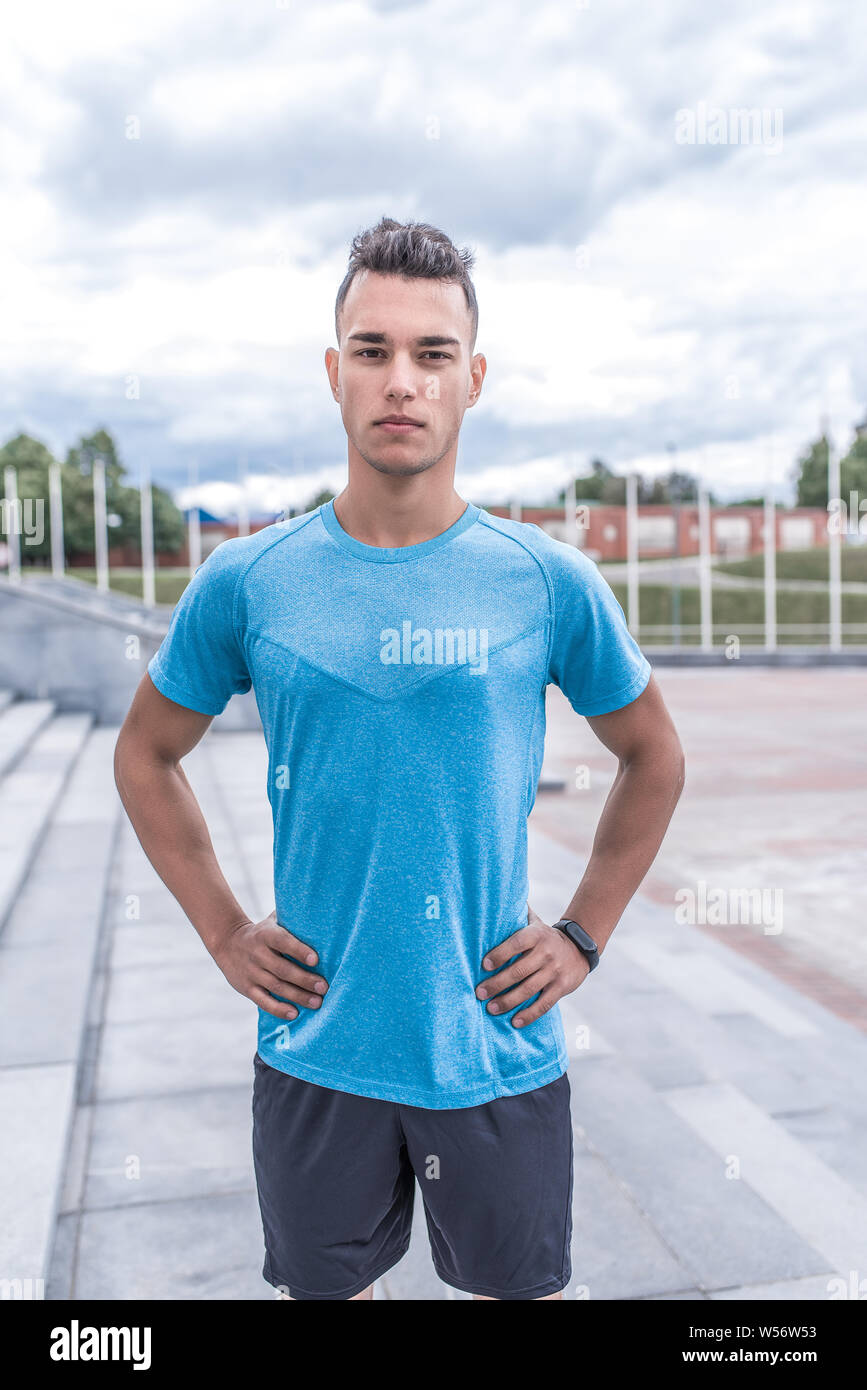 Young guy, male sports athlete, summer in city, posing, fitness training,  workout, healthy lifestyle. Sportswear, strength and endurance, motivation  Stock Photo - Alamy