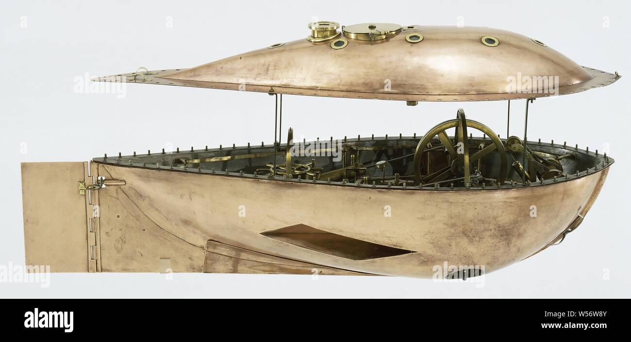 Model of a submarine, Model of a Submarine, Copper model of a submarine on a wooden stand, with a separate wooden box with tools. Drop-shaped hull with flat edge around it, on which a guard rail. The upper dome has a number of lights, a cockpit and a water-tight manhole, inside is a compartment for the mechanics and drivers, this compartment can be lifted out so that the diving tank underneath becomes visible. The propulsion is done by hand: with a crank, gear and a flywheel on either side, centrifugal pumps are driven, which push the water backwards through nozzles. The diving tank is filled Stock Photo