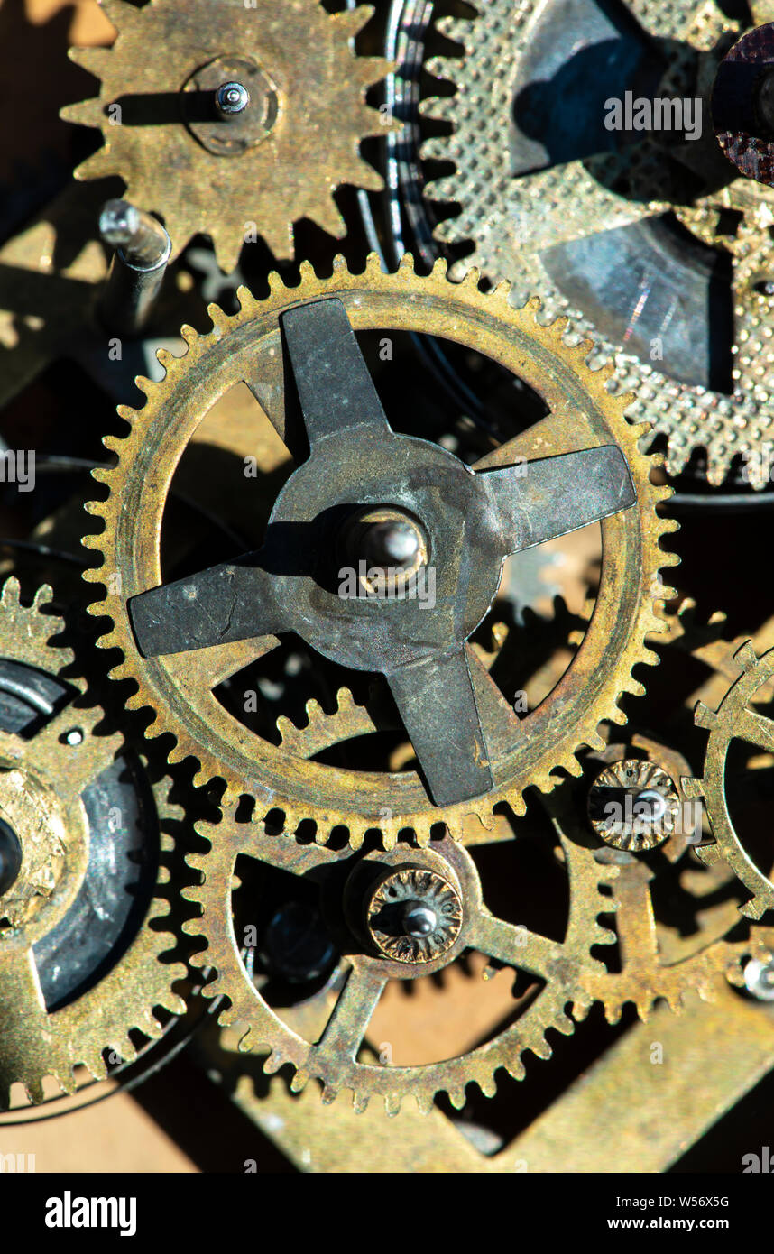 Close up metal gears mechanism. Golden colours. Hard light. Clock ...