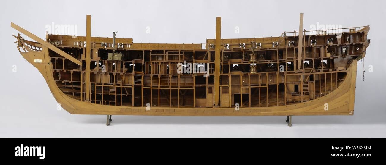 Model of an 84-Gun Ship of the Line (starboard side), Truss model of the hull (starboard side), cut lengthwise. The model is fully fired and extremely detailed. Seventy-six cannons and carronades have been preserved, the model has ninety-six gun ports spread over three decks. Five levels: cow bridge with locally lower levels, lower deck, intermediate deck, closed box and half deck with covered pit, upper campaign with two oval roses, all shot at with doors, stairs, cupboards, cages etc. The figurehead is a crowned walking man (Neptune), the galleon is decorated with sea attributes and has Stock Photo