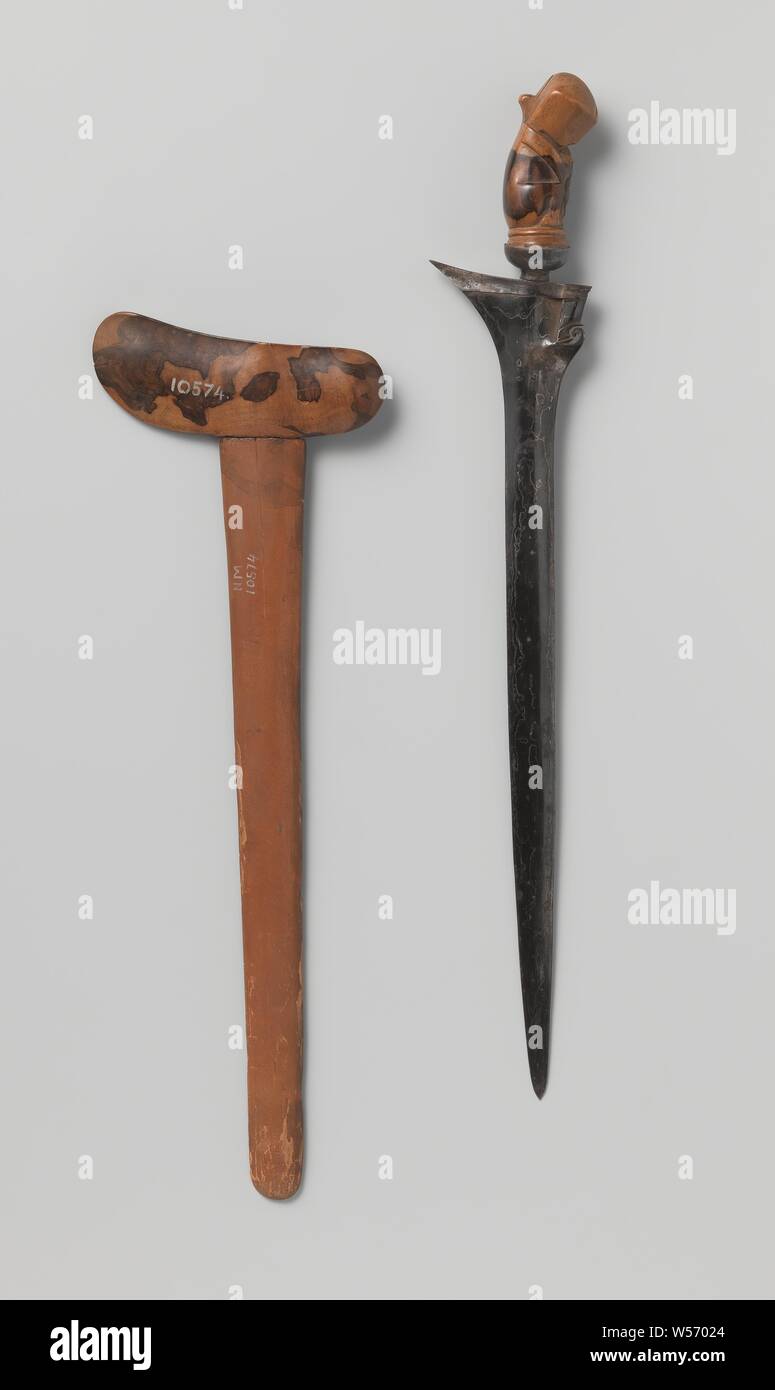 Kris from Bali with scabbard, Kris from Bali with black damasked blade with silver flames, with richly carved with silver mounted hilt. Only half of the sheath is present. Captured on the expedition from Lombok in 1894, Lombok, anonymous, Bali, in or before 1894, iron (metal), silver (metal), wood (plant material), l 52.5 cm w 14.4 cm × h 3.2, l 50.2 cm w 2.3 cm Stock Photo