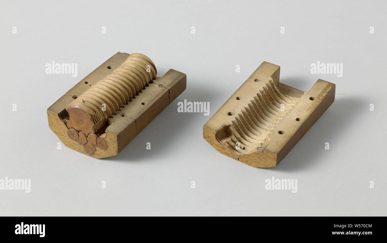 Model that shows how galls can be put into cannons, Beech wood model with palm-wood screws, which shows how galls (air holes that arise during the casting of iron) can be put into cannons. Probably associated with records in the State Archives, related to the stopping of galls in guns, which were cast by the gunman Jan Verbruggen in The Hague., Jan Verbruggen, The Hague, 1760 - 1762, beech (wood), boxwood, h 10.6 cm × w 5.2 cm Stock Photo