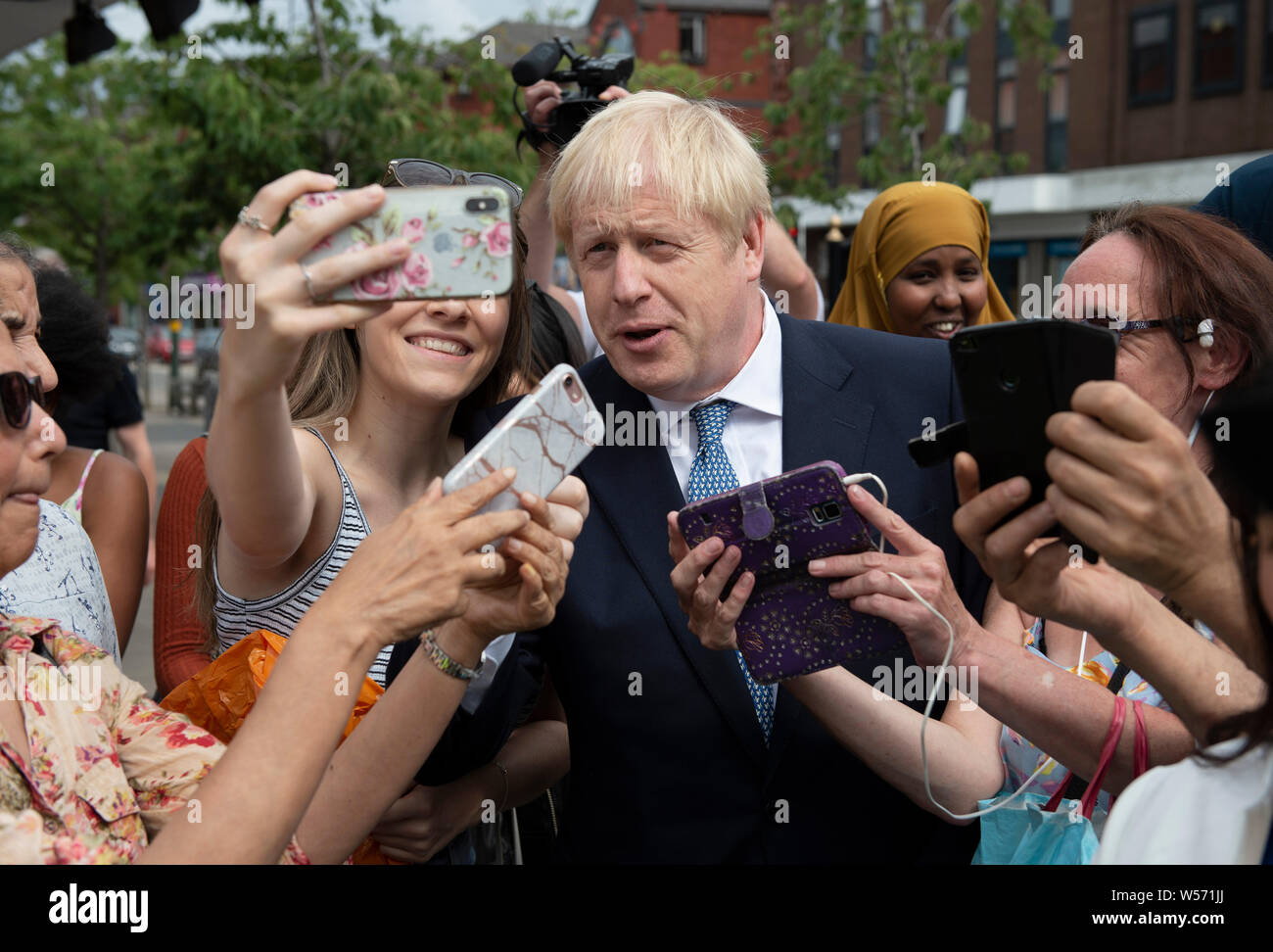Prime Minister Boris Johnson on a walkabout during a visit to North Road, Harbourne, Birmingham before announcing his plan to recruit an extra 20,000 police officers and an urgent review will take place of plans to make it easier for forces to use stop-and-search powers. Stock Photo