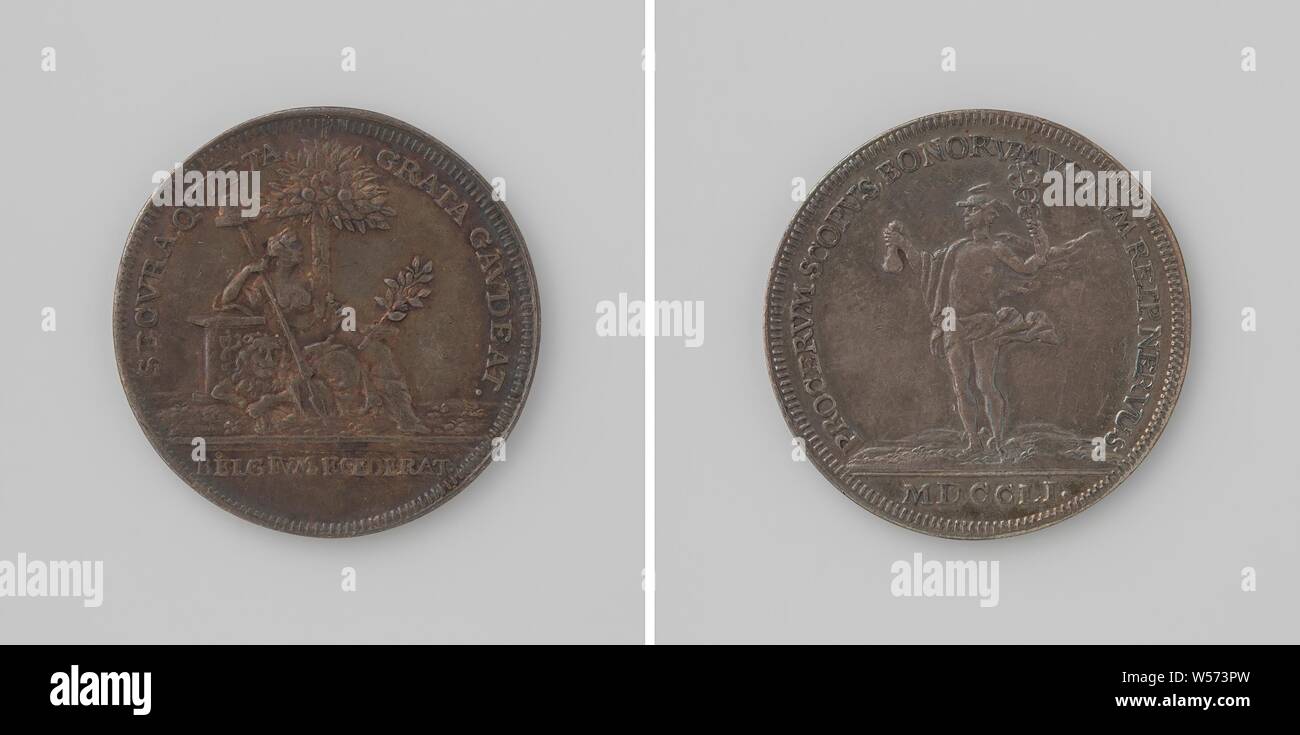 Beginning of the year 1751, Silver Medal. Obverse: The Netherlands, depicted as a woman with a liberty hat on a lance and olive branch and offering bowl, sits under fruit-bearing orange tree, a lion with a bundle of arrows at her feet, with her right arm she leans on an altar within a circle, cut off: inscription. Reverse: Mercury with staff and scholarship within scope, cut: year, Johan George Holtzhey, Amsterdam, 1751, silver (metal), striking (metalworking), d 3 cm × w 10.27 Stock Photo