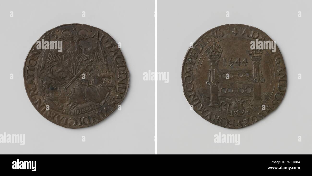 Success of Charles V, German Emperor in the war against France, Copper Medal. Front: two-headed eagle pierced with two swords lying on the ground, representing Faithlessness above inscription within inscription. Reverse: scandal block under year between columns of Herkules, on which chains hang, on ground chains within a circumference, France, Charles V of Habsburg (German emperor and king of Spain), anonymous, 1544, copper (metal), striking (metalworking), d 2.9 cm × w 52 Stock Photo