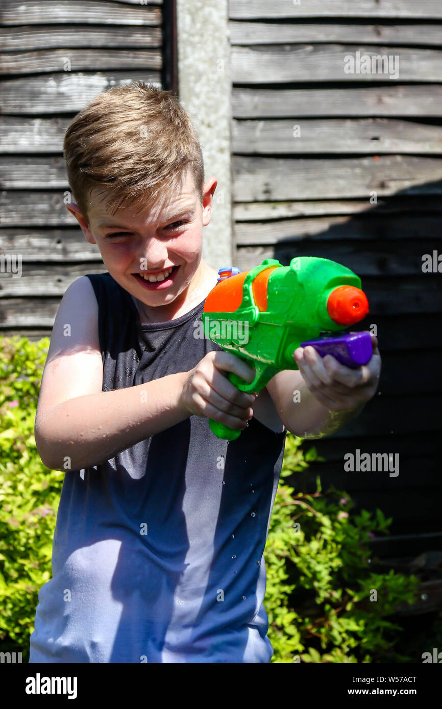 Teen boy with water Stock Photo by ©VaLiza 116935330