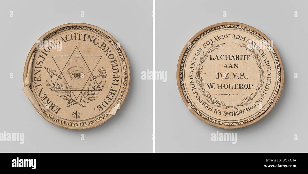 Lodge 'La Charite', medal awarded to its chairman Willem Holtrop in honor of his fifty-year membership, Paper medal. Front: all-seeing eye in the center of two overlapping triangles between trowel and hammer, above two crossed laurel branches and star inside an inscription. Reverse: inscription within laurel wreath, inscription and decorative border, Amsterdam, Willem Holtrop, anonymous, Netherlands, 1834, paper, cardboard, striking (metalworking), d 5.2 cm × w 6.65 Stock Photo
