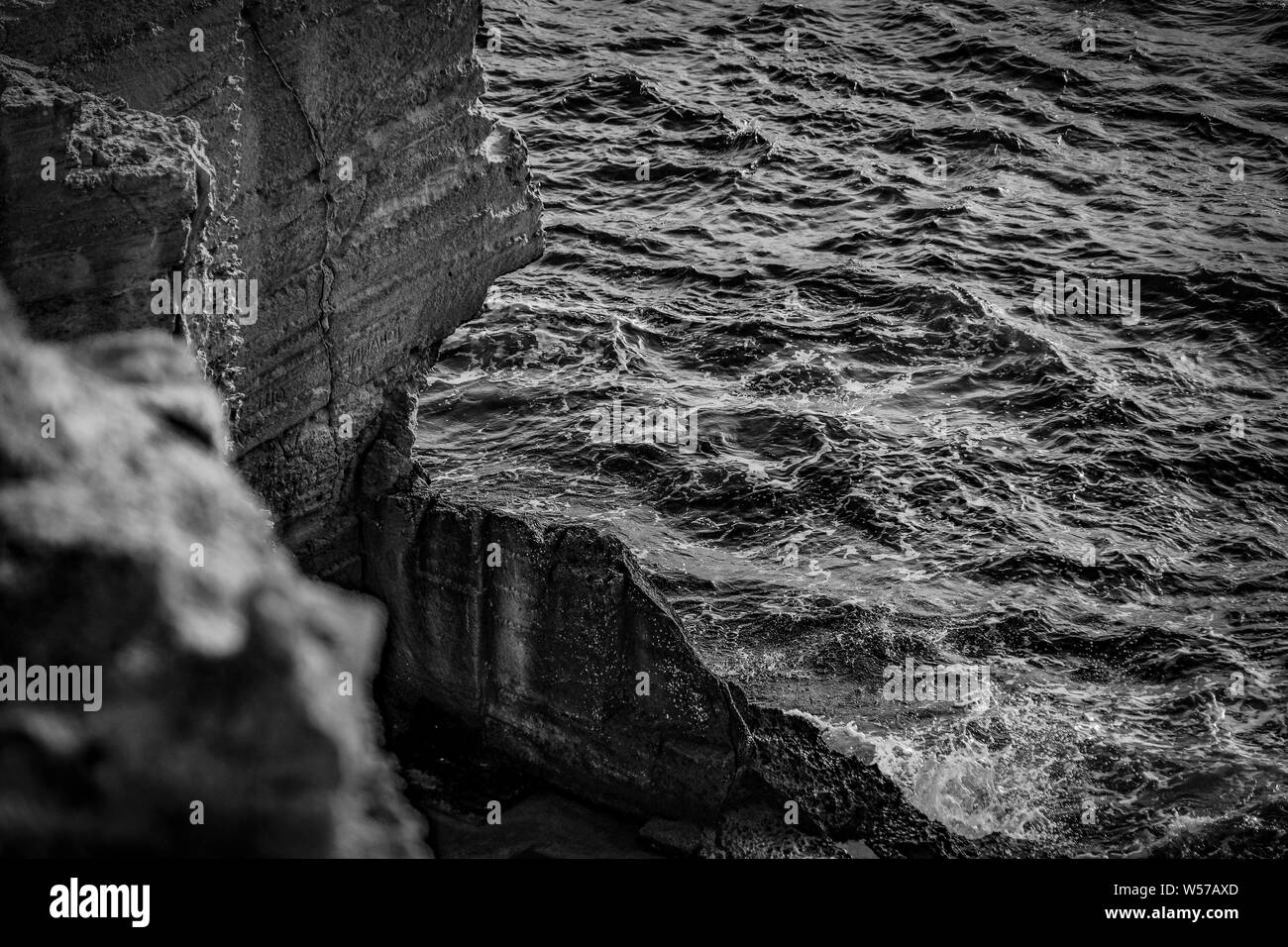 Waves break spray on Black and White Stock Photos & Images - Alamy
