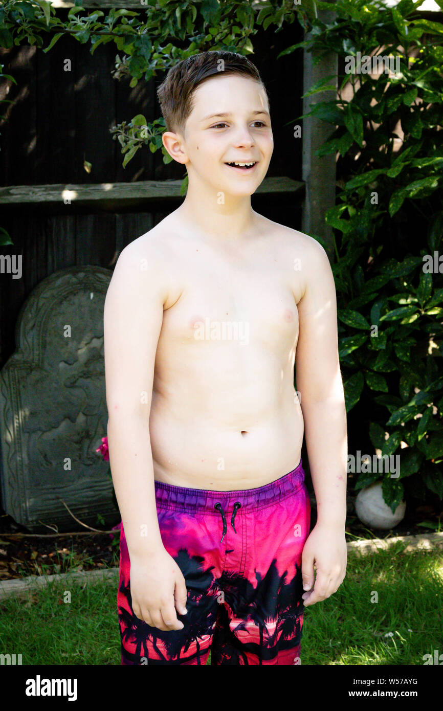 preteen boy models Shirtless preteen boy in swimwear standing on a hot summer's day Stock  Photo - Alamy