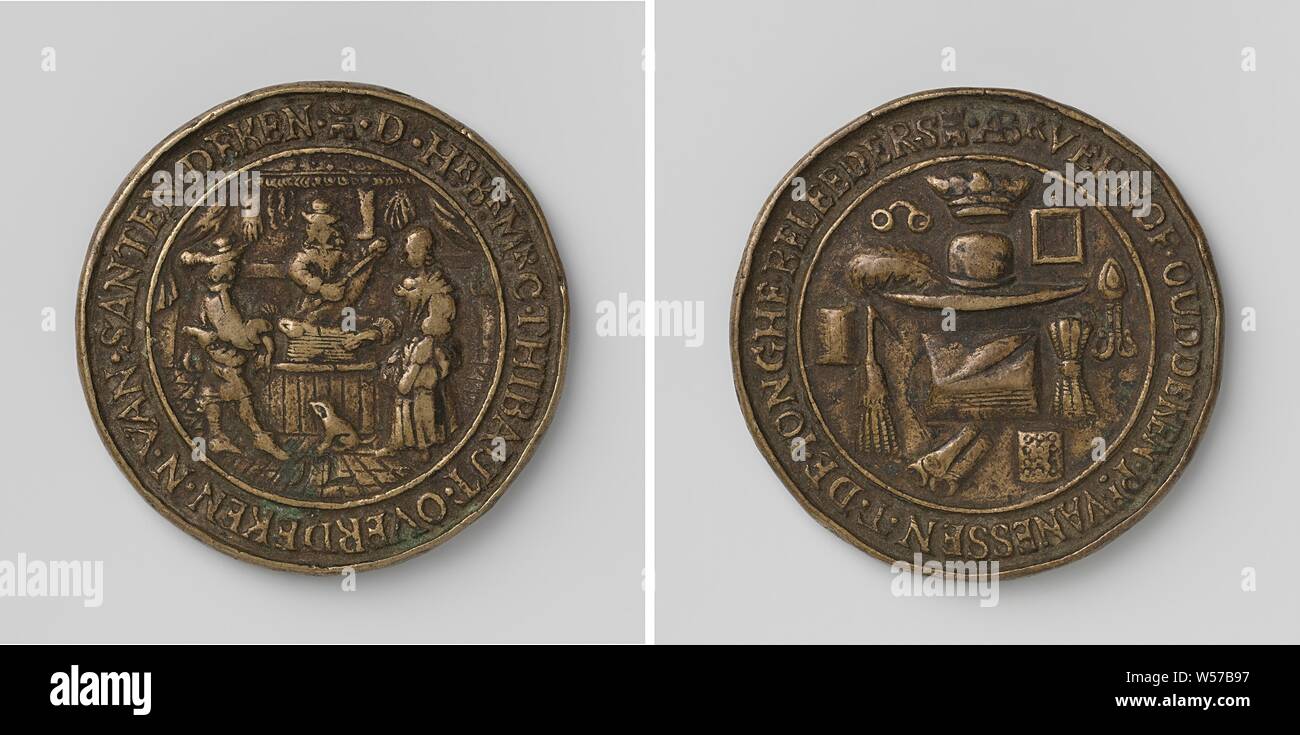 Silk cloth buyers and traders guild from Middelburg, guild token with no. 12, Brass token. Front: below year: cloth merchant, standing behind counter in his shop with a piece of fabric, left and right: male and female, between the two: digit 12 within a circle. Reverse: crowned hat with feather, around it: glasses, guy, comb, brush, pot, knitting yarn, three rolls and a suit inside a cover, Middelburg, C. Thibaut, N. van Santen, Abr. Verhof, Pr. van Essen, T. de Jonghe, Johannes van Houten, 1677, brass (alloy), engraving, d 5.6 cm × w 57.85 Stock Photo