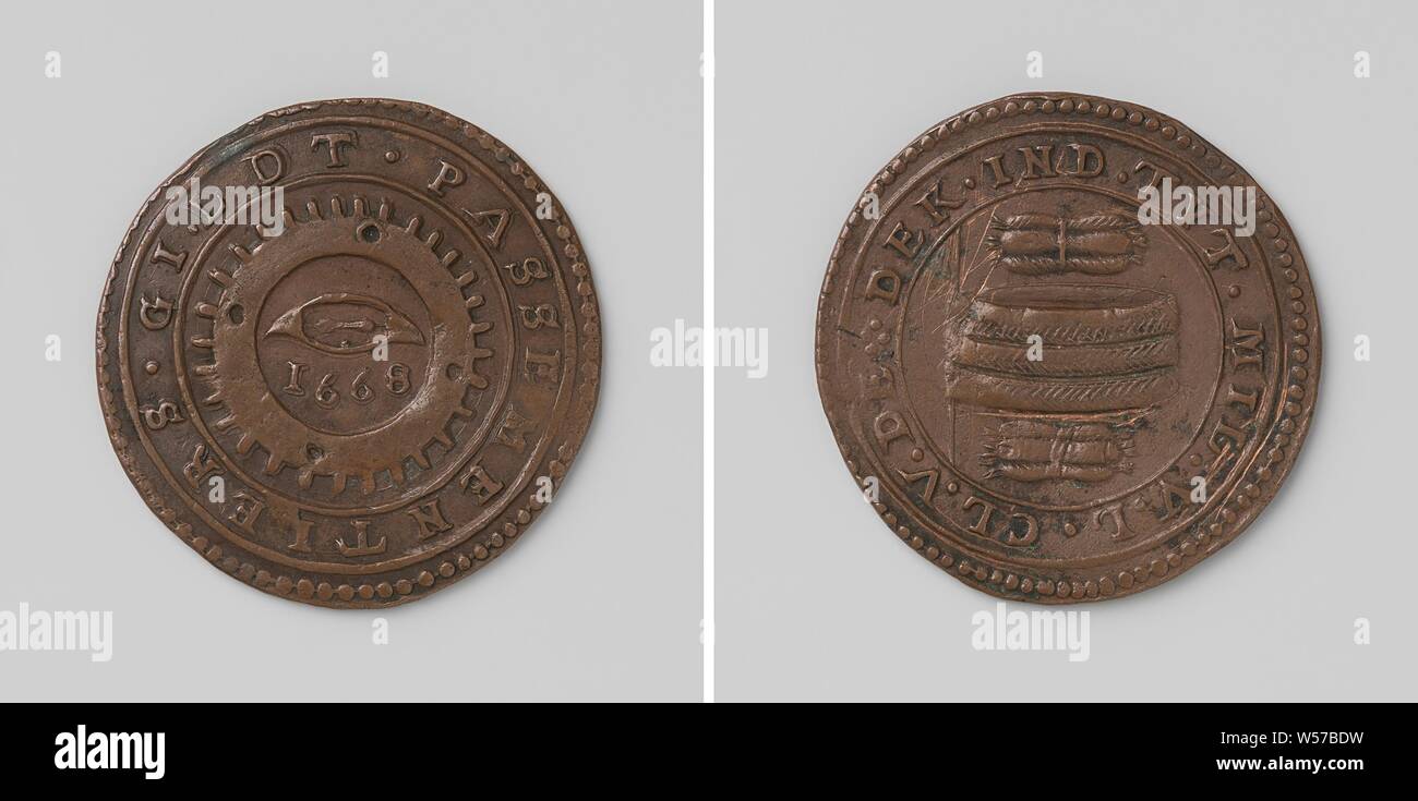 Government Workers Guild, Copper Medal. Front side: reel above year in reel wheel within a circle. Reverse: roll between two pieces of bulletin within the scope, anonymous, Netherlands, 1668, copper (metal), striking (metalworking), d 3.5 cm × w 9.52 Stock Photo