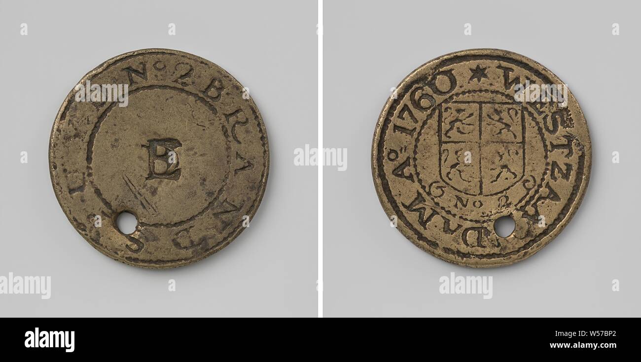 West Zaandam, fire spray token from sprayer 2 with unclear monogram or number, Brass token with hole in it. Obverse: unclear monogram, possibly letter E with other letter or number through it within a circle. Reverse: coat of arms above inscription no. 2 inside inscription, anonymous, 1760, brass (alloy), engraving, d 3.3 cm × w 15.54 Stock Photo