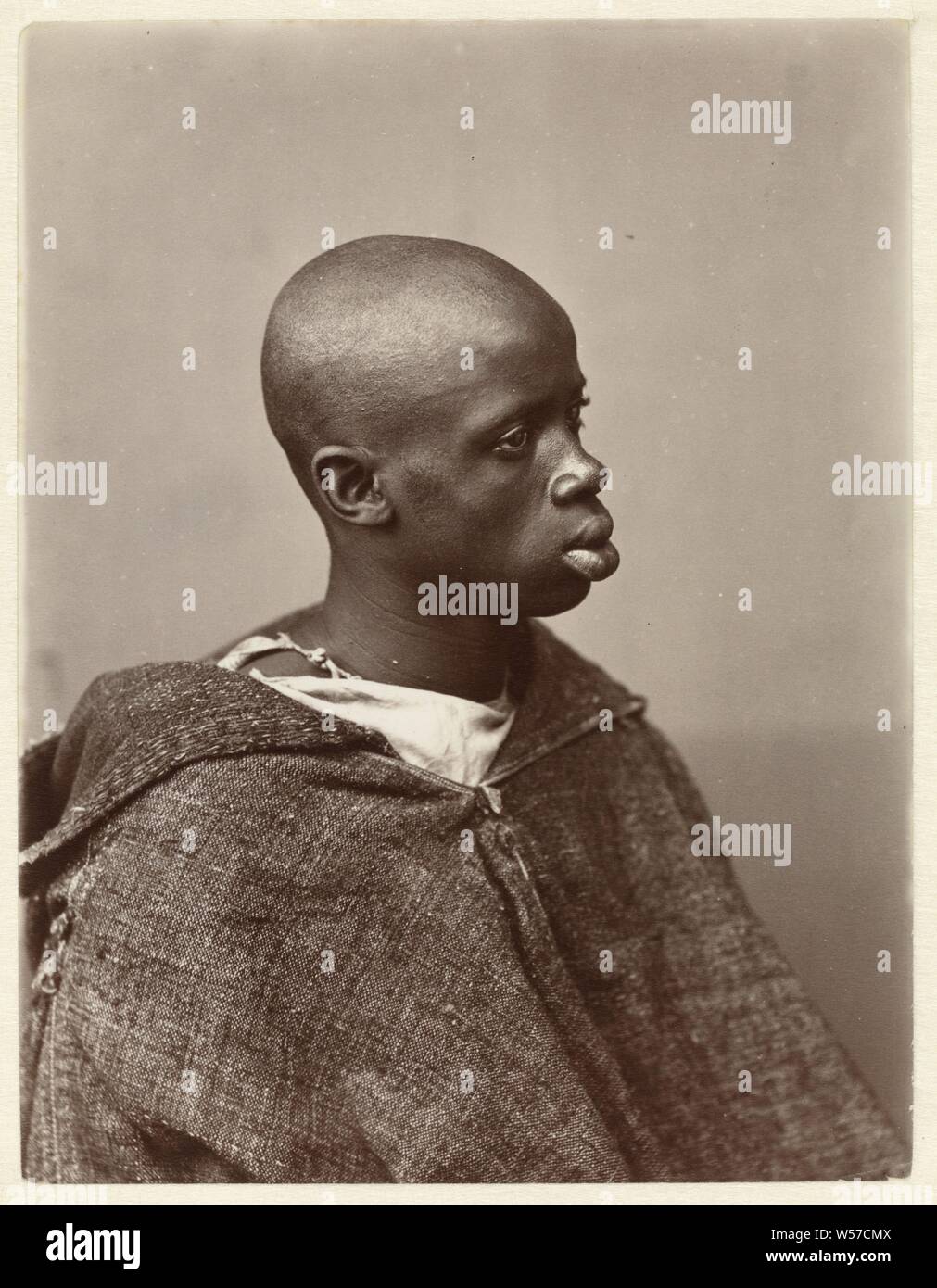 Portraits of Hamido Laâmbre Portrait of Hamido Laâmbre, Rotated three quarters., Child, child playing with animals, Antonio Cavilla, Noord-Afrika, c. 1884, paper, photographic paper, albumen print, h 199 mm × w 153 mm Stock Photo