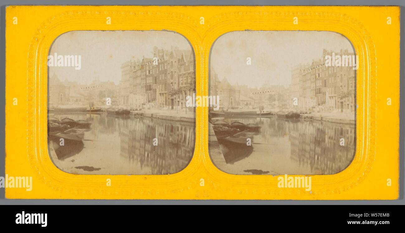 View of a canal in Amsterdam with the Waag on the Nieuwmarkt on the left, canals, waters (in city), weigh-house, Amsterdam, Waag on the Nieuwmarkt, Jules Marinier (mentioned on object), 1860 - c. 1875, photographic paper, cardboard, cutting, h 87 mm × w 177 mm Stock Photo