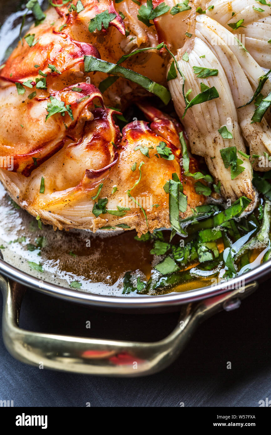 Beautiful giant lobster tenderloin with sauce and coriander Stock Photo