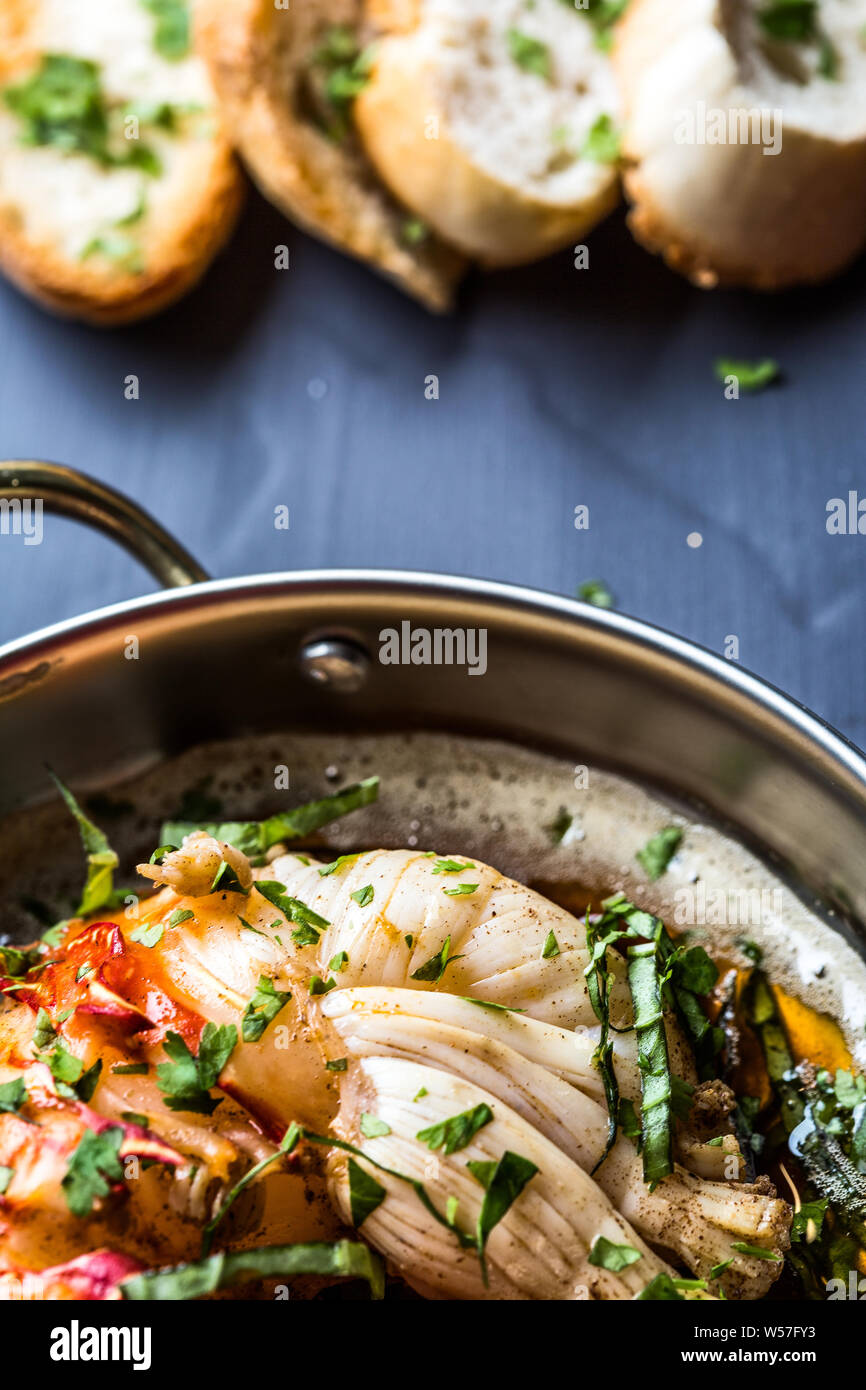 Beautiful giant lobster tenderloin with sauce and coriander Stock Photo