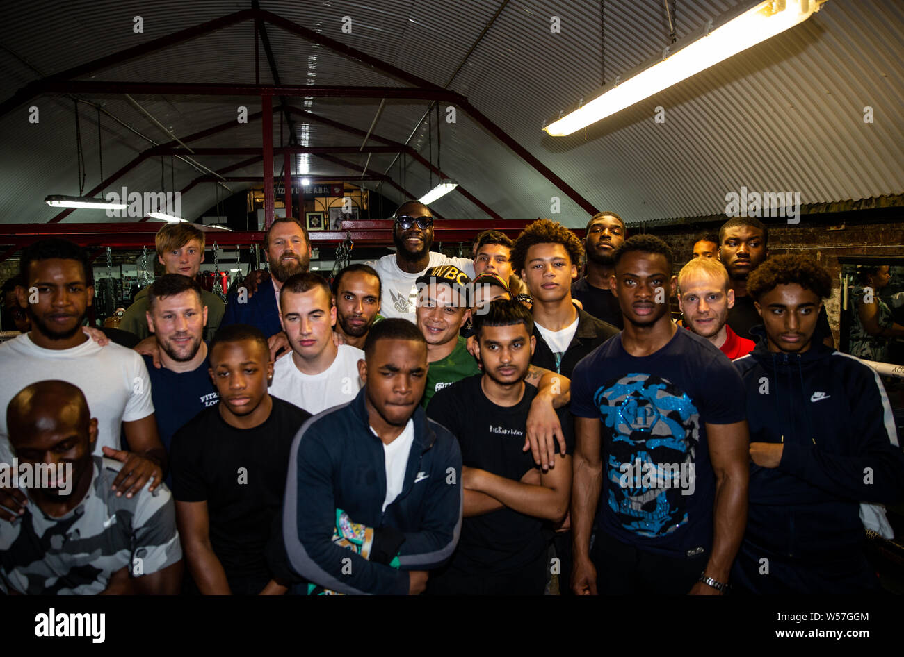 Deontay Wilder Poses With Young Boxers During The Photocall At Fitzroy Lodge Gym London Stock Photo Alamy