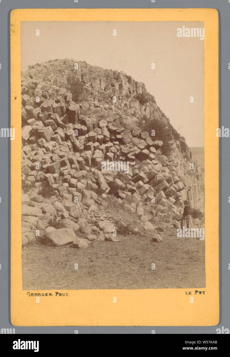 Rock formation at Le Puy-en-Velay Le Puy (title on object), rock formations, Le Puy -en-Velay, A. Georges (mentioned on object), Le Puy-en-Velay, 1870 - 1900, cardboard, photographic paper, albumen print, h 168 mm × w 108 mm Stock Photo