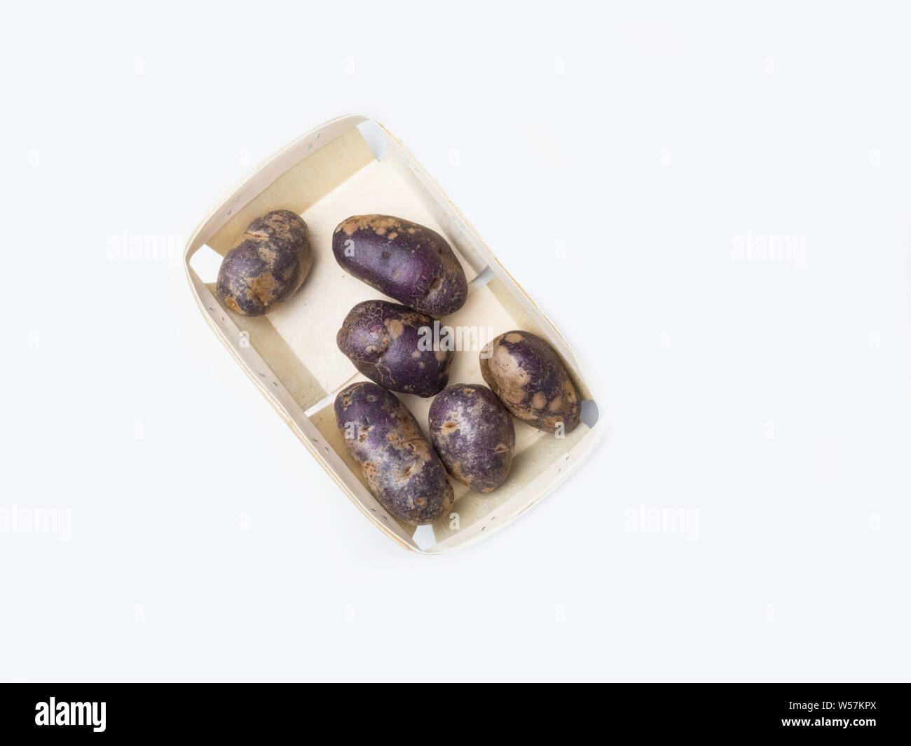 Freshly harvested organic sweet potatoes in wooden box. Sweet potato