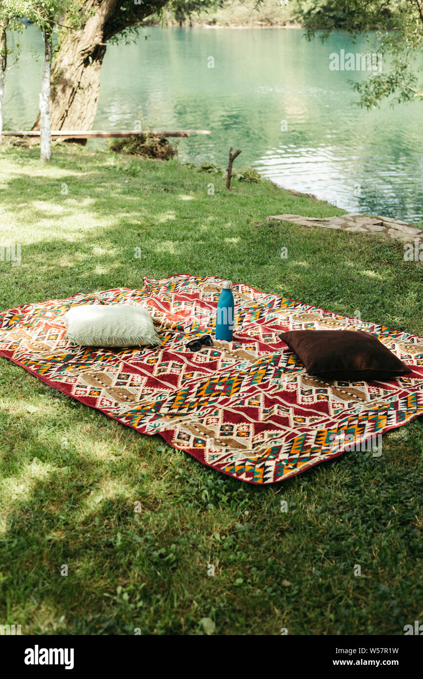A colorful blanket on the grass Stock Photo Alamy