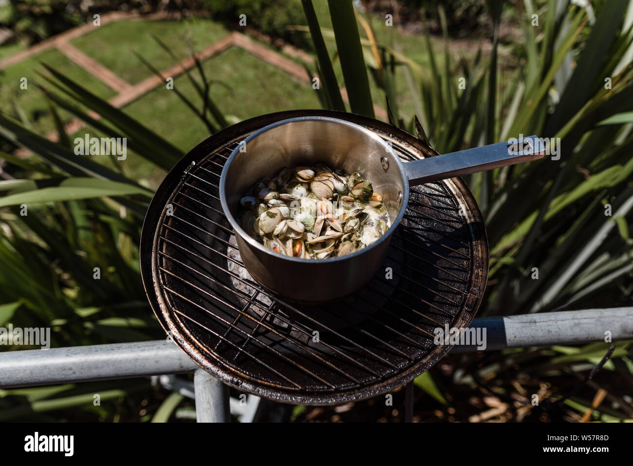 Pot of fresh shellfish on a balcony grill Stock Photo