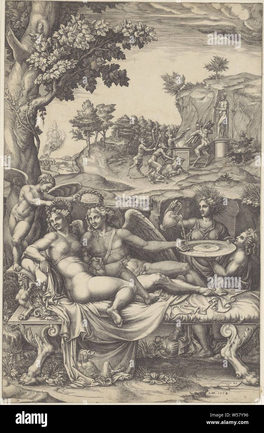 Amor and Psyche, Amor and Psyche lie on a chaise longue with their child (Voluptas) landscape. A winged figure holds laurel wreaths above the heads of Amor and Psyche. On the right Ceres pours water on Amor's hand. His hand is leaning on a scale carried by Juno. In the background a group of satyrs offering a goat for a statue of the gods. In the foreground lies a dog., Cupid and Psyche as lovers, Giorgio Ghisi (mentioned on object), 1574, paper, engraving, h 357 mm × w 229 mm Stock Photo
