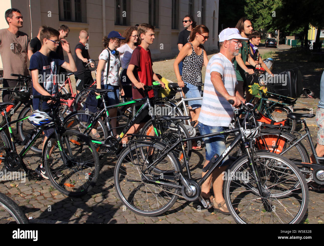 26 July 2019, Germany (German), Magdeburg: Students and residents of Magdeburg have come with bicycles to the demonstration for more climate protection. The Magdeburg Fridays for Future movement had called for the first Climate Moon during the summer holidays. Photo: Peter Förster/dpa-Zentralbild/dpa Stock Photo