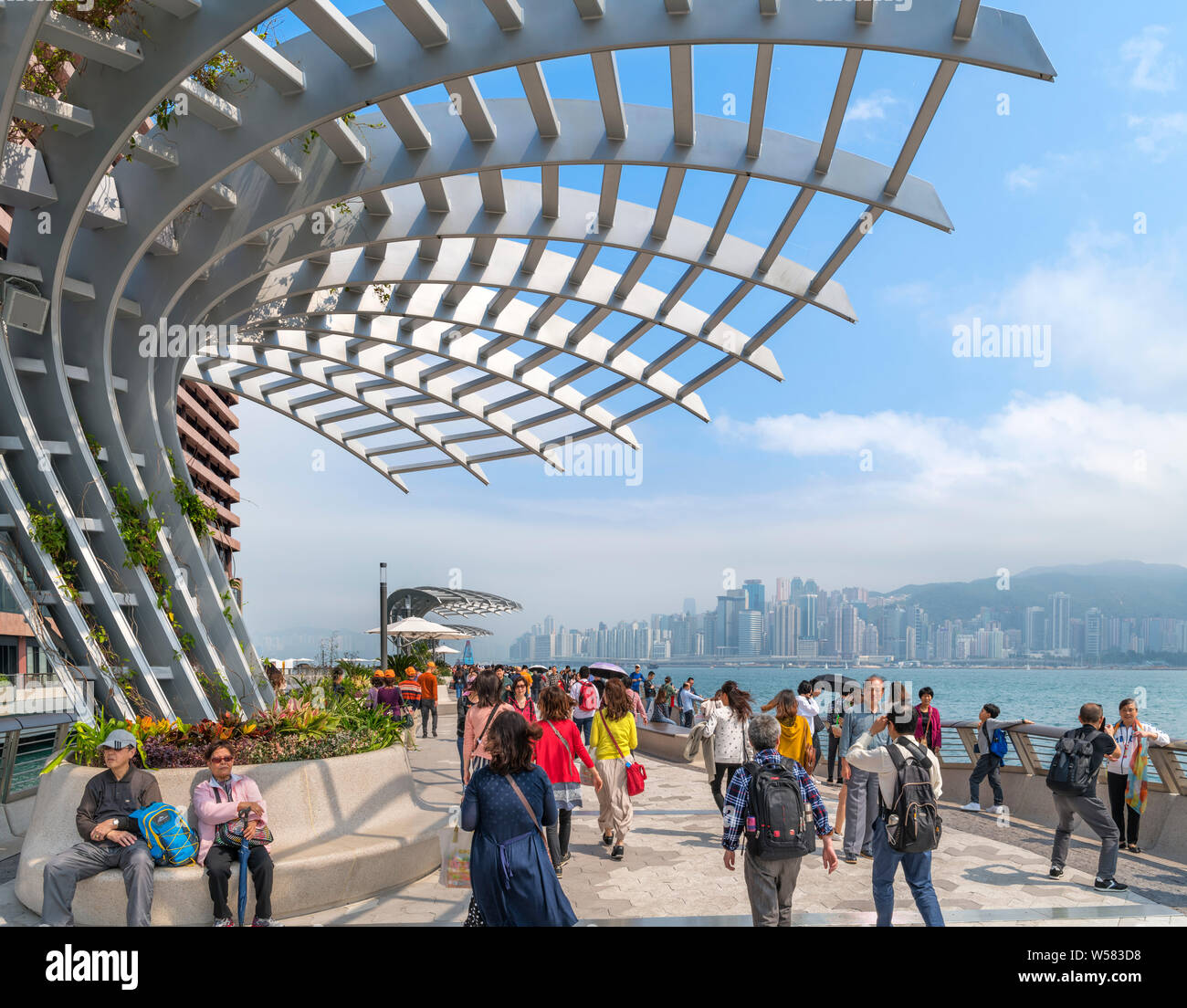 Avenue of the Stars looking towards high rise buildings on Hong Kong Island, Tsim Sha Tsui Promenade, Kowloon, Hong Kong, China Stock Photo