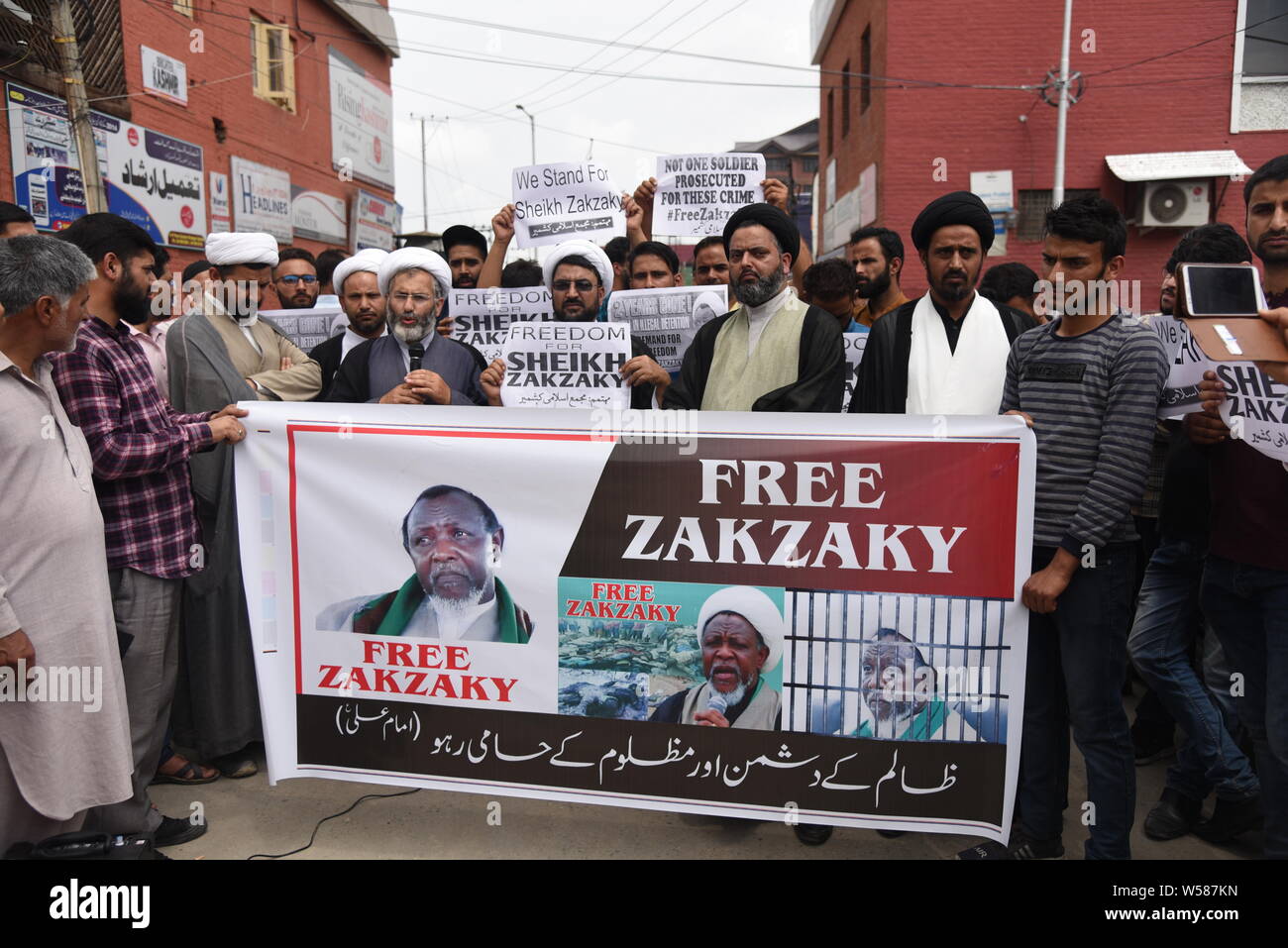 Kashmiri Shia Muslim demonstrators hold a banner during a protest in Srinagar.Members of the Shia Community of Kashmir extended their support to Sheikh Ibrahim Yaqoub El Zakzaky, the head of Nigeria's Islamic Movement, demanding his immediate release. Sheikh Zakzaky converted from Sunni Islam to Shiasim and now is in police custody facing accusations of leading a violent group that has clashed with Nigerian law enforcement agencies, including the army, on multiple occasions in the last few years. Stock Photo