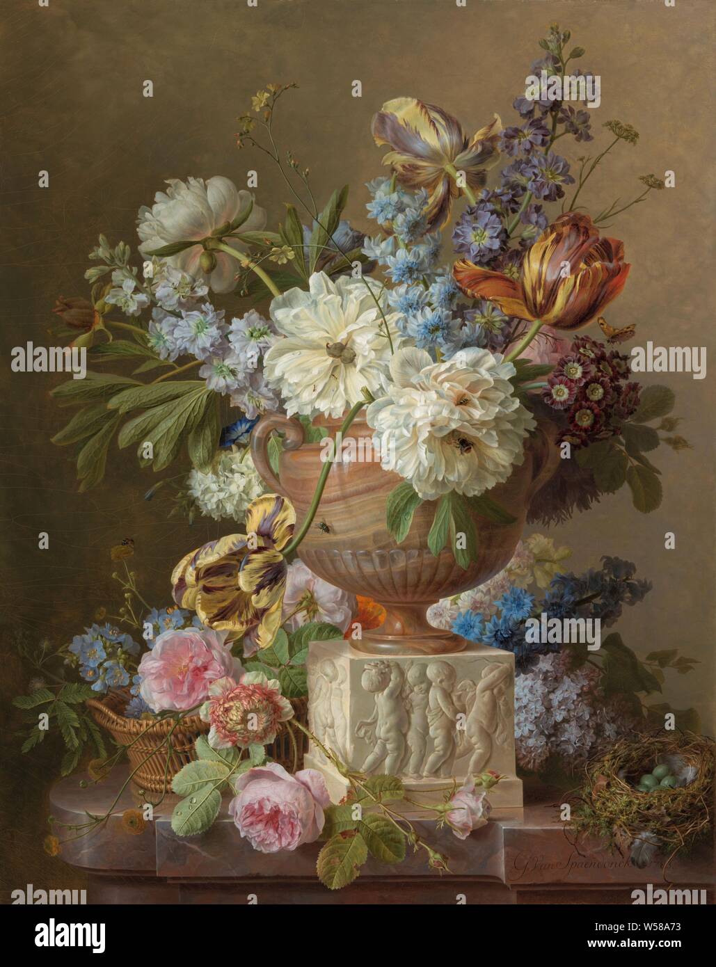 Flower Still-life with an Alabaster Vase, A bouquet of flowers in an oriental vase of alabaster, placed on a marble block on which children are depicted in bas relief. This marble block has been placed on a granite balustrade. On the right a nest covered with moss with five green eggs, on the left a basket with flowers. The selection of flowers includes large white and smaller pink peonies, blue delphinium, lilac, and yellow-purple flamed tulips. Here and there you can see insects (a fly, a bee and a bumblebee), flowers in a vase, flowers, cut flowers, nosegay, bunch of flowers, insects, birds Stock Photo