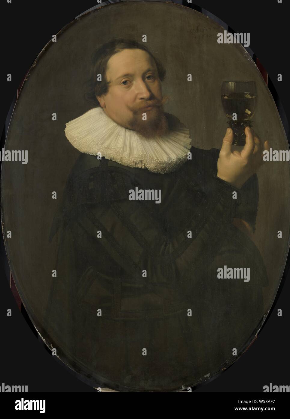 Portrait of Maerten Rey (1595 / 96-1632), Oval portrait of Maerten Rey (1595 / 96-1632). Wine buyer and castelein of the Archery Goals. Half-way, to the right, in the right hand he holds up a roemer with white wine., Nicolaes Eliasz. Pickenoy, 1627, panel, oil paint (paint), support: h 98.3 cm × w 73.3 cm d 7.5 cm Stock Photo