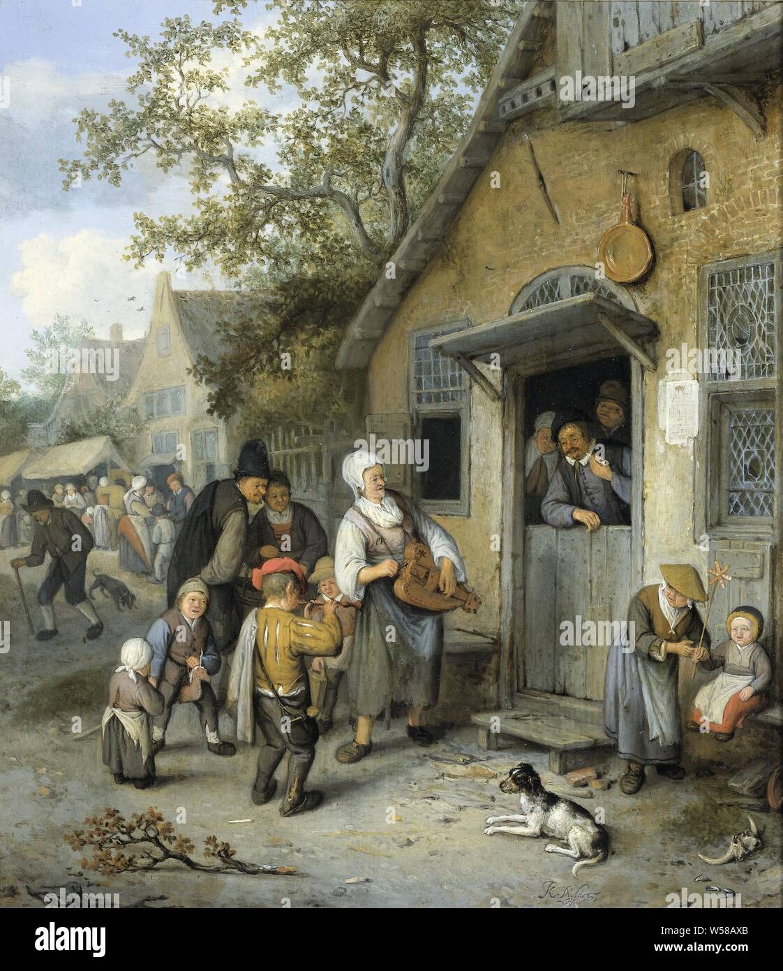 Country Funfair, Farmers Funfair. At the entrance of a house a woman plays on a hurdy-gurdy and a boy on the flute. Leaning over the bottom door, a man with a pipe listens to the musicians. Children and a dog playing in front of the house, in the distance the stalls of the fair, festivities, village street, flute, aulos, tibia - CC - out of doors, hurdy-gurdy - CC - out of doors, Cornelis Dusart, 1680 - 1704, panel, oil paint (paint), h 36.5 cm × w 32.5 cm Stock Photo