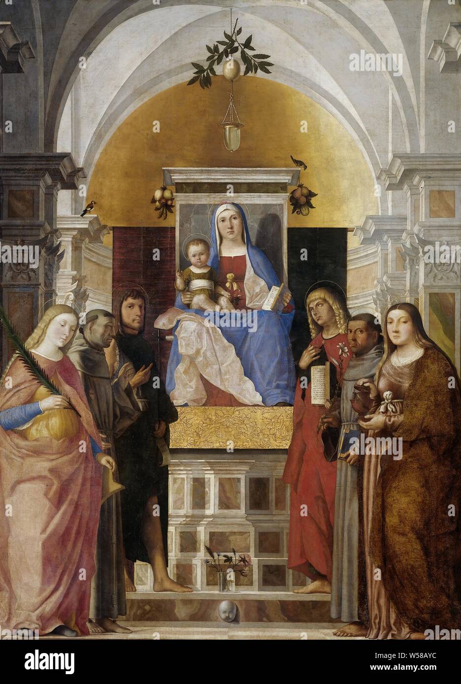 Madonna and Child with Sts Catherine, Francis of Assisi, John the Baptist, John the Evangelist, Antony of Padua and Mary Magdalene, Mary with child and saints. Church interior with in the middle Mary with the Christ child and a book sitting on his lap on a raised throne. Saints Catherine, Francis and John the Baptist on the left. On the right the saints Mary Magdalene, Anthony of Padua and John the Evangelist. On the step before the throne is a glass vase with some flowers, at the corners of the throne are bunches of fruit., Marcello Fogolino, 1510 - 1520, canvas, oil paint (paint), h 266 cm Stock Photo