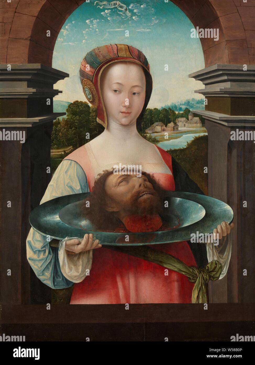 Salome with the Head of John the Baptist Salome and the Head of John the Baptist, Salome with the head of John the Baptist on a large round tin dish. Standing under an arch, in the distance a landscape with farms on a river, the head of John the Baptist on a platter, Jacob Cornelisz van Oostsanen, Amsterdam, 1524, panel, oil paint (paint), support: h 71.8 cm × w 53.6 cm frame: h 83.8 cm × w 66.5 cm × t 5.5 cm Stock Photo