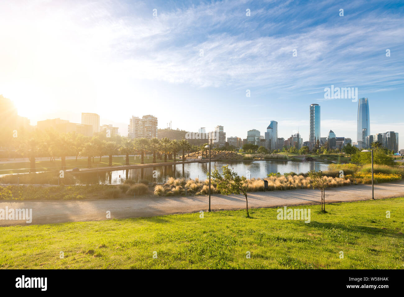 Skyline of buildings at Las Condes district and the pond at Bicentennial Park in Vitacura, Santiago de Chile Stock Photo