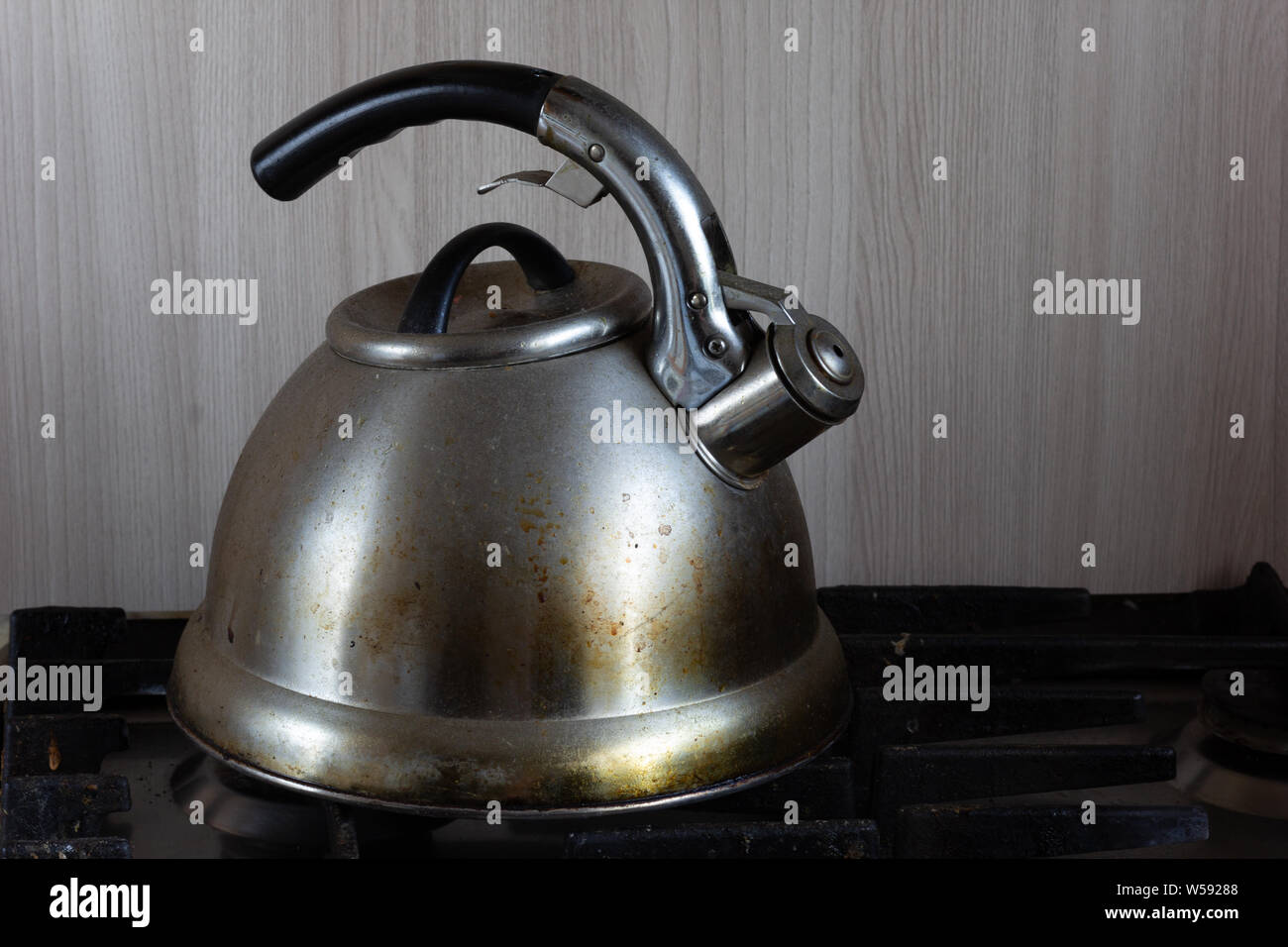 Dirty teapot on the stove Stock Photo Alamy