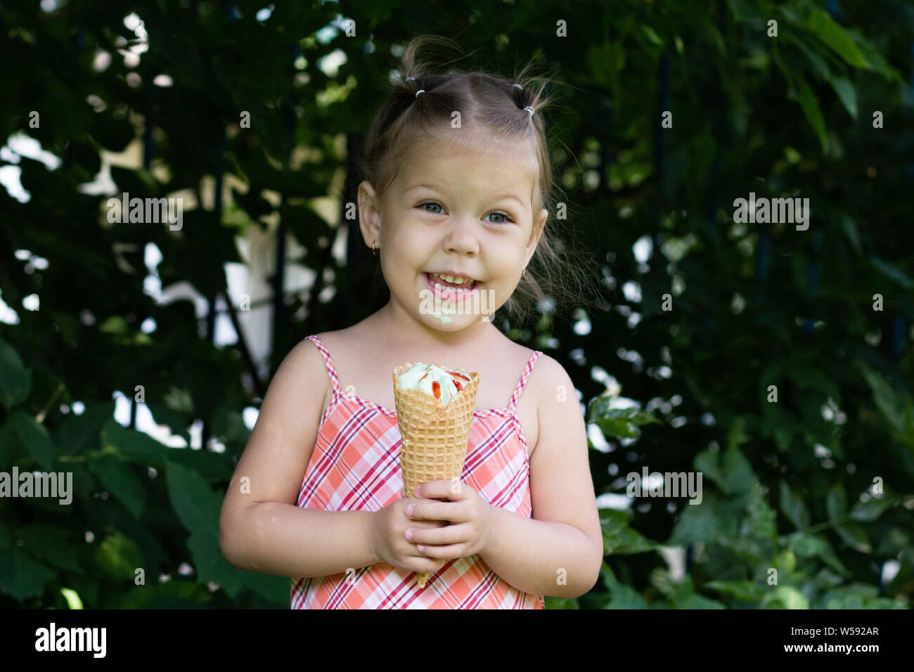 Happy little girl in the summer park Stock Photo - Alamy