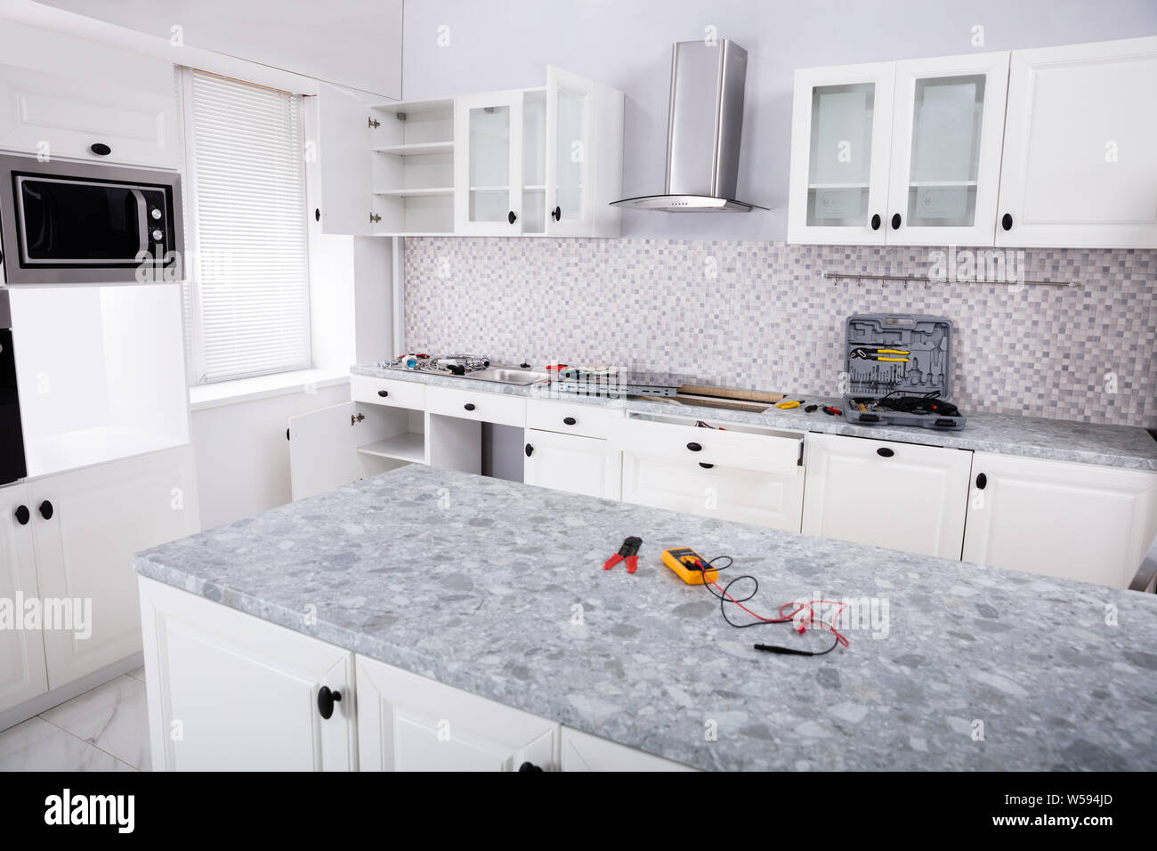 Close-up Of An Electrical Kitchen Induction Ceramic Hob In Kitchen With Tools Stock Photo