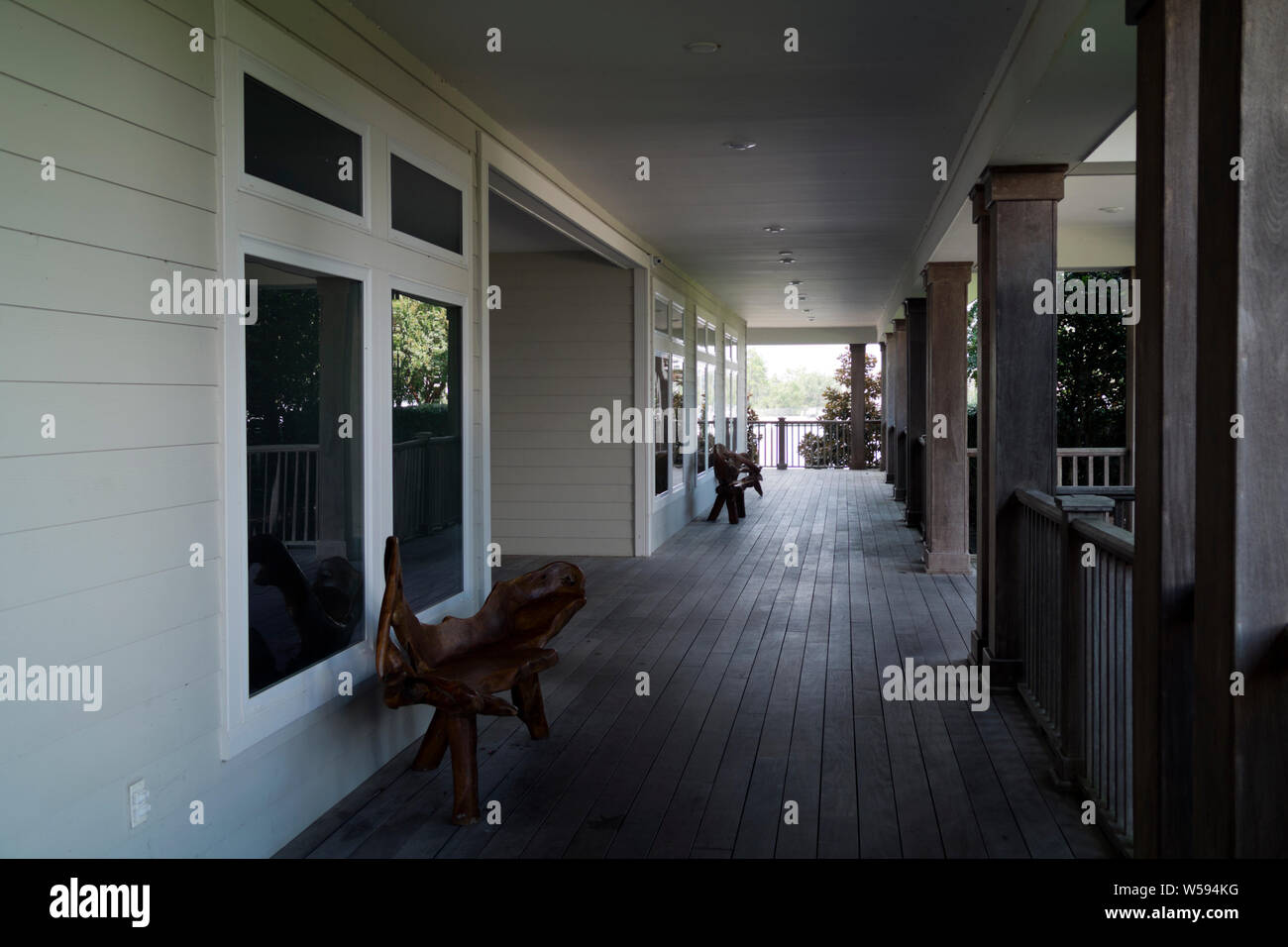 Rustic, sculpted furniture on the porch at Barber Marina in Elberta, Alabama, USA. Stock Photo